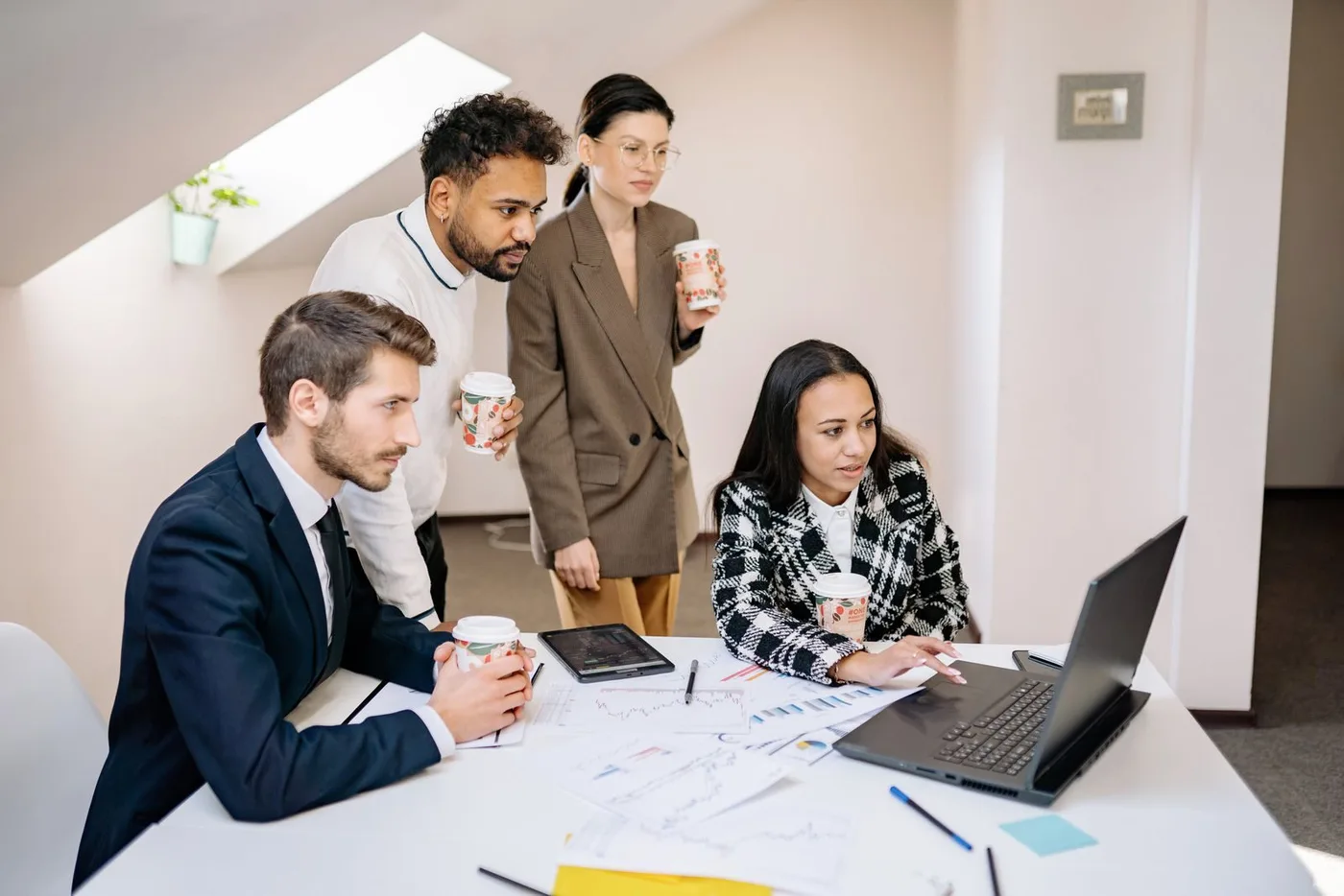 Team working together around a laptop