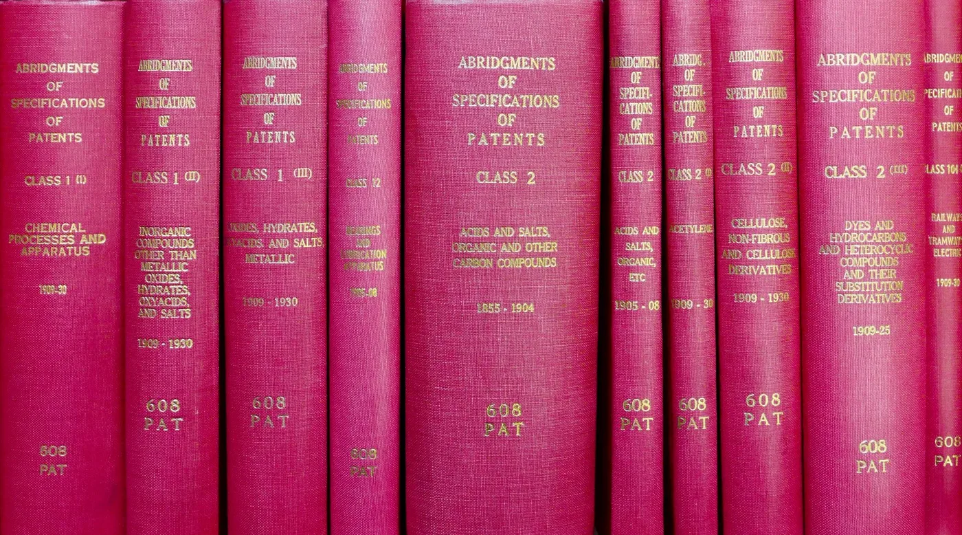 A shelf of bound Abridgments of Specifications of Patents